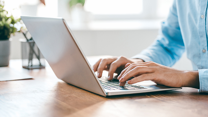 Person typing on a laptop
