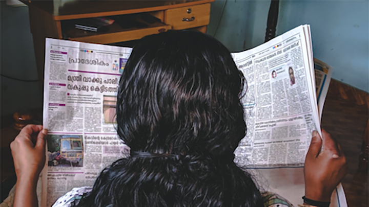 Woman reading a newspaper