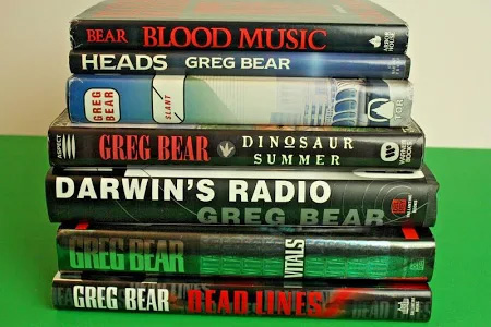 Stack of books by Greg Bear