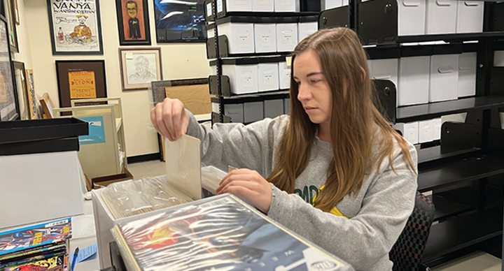 Student works with archival materials