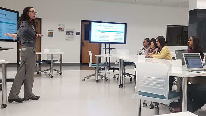 Digital Humanities Librarian Pamella Lach leads an instruction session with a group of students in the DH Center. 