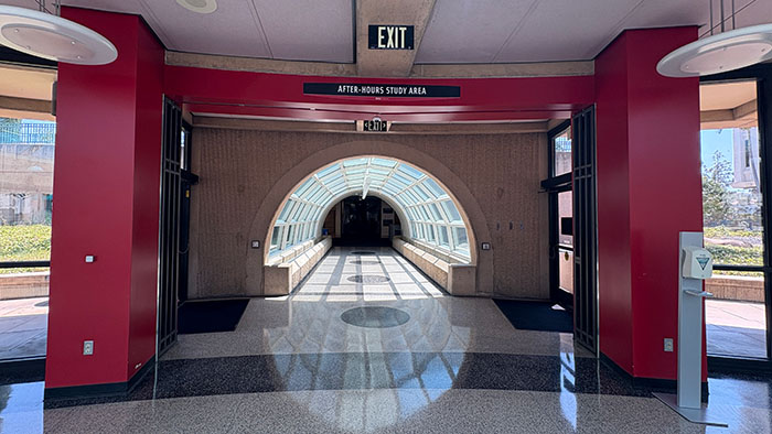 Glass tunnel entrance to SDSU Library's After Hours Study Area, located beneath the iconic library dome.