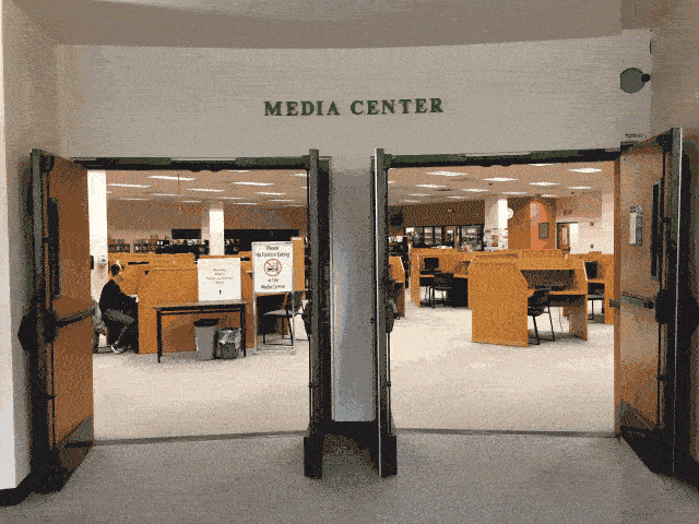 Gif showing the change of the entrance signage from Media Center to Digital Humanities Center
