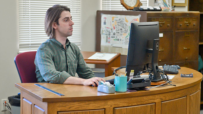 A SCUA staff member at the service desk